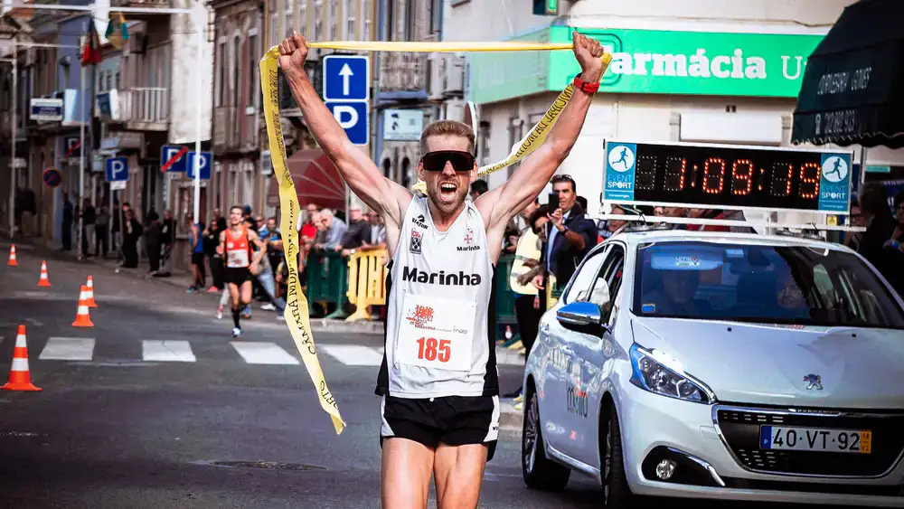 Runner celebrating a new world record at an event